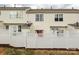 Townhouse exterior with a fenced patio, windows, and light siding at 811 Gentlewinds Ct, Fort Mill, SC 29708