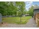 Private backyard with mature trees, and a storage shed, offers ample space at 8850 Hills Dell Dr, Concord, NC 28027
