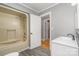 Clean bathroom with modern vanity, bathtub, and updated fixtures at 8850 Hills Dell Dr, Concord, NC 28027