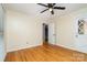 Inviting bedroom with hardwood floors and a door leading to another room at 8850 Hills Dell Dr, Concord, NC 28027