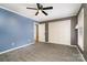 Charming bedroom with blue accent wall, carpet, and closet offers comfortable living space at 8850 Hills Dell Dr, Concord, NC 28027