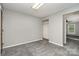 Cozy bedroom with closet and neutral walls provides a serene and comfortable space at 8850 Hills Dell Dr, Concord, NC 28027