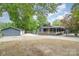 Home with a detached garage and additional parking in a serene, wooded setting at 8850 Hills Dell Dr, Concord, NC 28027
