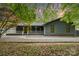 Charming home featuring a covered front porch, cozy curb appeal, and manicured front yard at 8850 Hills Dell Dr, Concord, NC 28027
