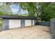 Detached two-car garage with ample parking space and convenient access to the property at 8850 Hills Dell Dr, Concord, NC 28027
