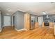 Open kitchen with stainless steel refrigerator and hardwood floors at 8850 Hills Dell Dr, Concord, NC 28027