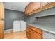 Functional laundry room with washer, dryer, and built-in cabinetry at 8850 Hills Dell Dr, Concord, NC 28027