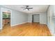 Spacious living room with hardwood floors and modern ceiling fan at 8850 Hills Dell Dr, Concord, NC 28027