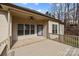 Back porch is partially covered and overlooks a treed backyard at 910 Pine Knoll Rd # 13, Fort Mill, SC 29715