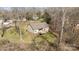 Aerial view of a serene backyard with a private deck and lush greenery, perfect for outdoor enjoyment at 910 Pine Knoll Rd # 13, Fort Mill, SC 29715
