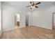 Airy bedroom with a fan and neutral colors featuring access to the ensuite bathroom at 910 Pine Knoll Rd # 13, Fort Mill, SC 29715