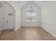 Formal dining room featuring hardwood floors, contemporary light fixture, and a large window at 910 Pine Knoll Rd # 13, Fort Mill, SC 29715