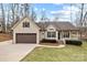Charming single-Gathering home features a covered front porch, attached two car garage, and manicured lawn at 910 Pine Knoll Rd # 13, Fort Mill, SC 29715