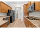 Bright kitchen with stainless steel appliances, granite countertops, and wood cabinets at 910 Pine Knoll Rd # 13, Fort Mill, SC 29715