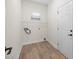 Clean and functional laundry room with overhead storage, washer and dryer hookups at 910 Pine Knoll Rd # 13, Fort Mill, SC 29715