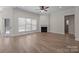 Spacious living room with hardwood floors, fireplace, and view to the backyard at 910 Pine Knoll Rd # 13, Fort Mill, SC 29715