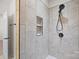 Walk-in shower with modern tile, rain shower head, and built-in shelving at 910 Pine Knoll Rd # 13, Fort Mill, SC 29715