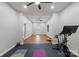 Spacious basement area with room for exercise equipment and recreation with vinyl floors and neutral paint at 9433 Wallace Pond Dr, Huntersville, NC 28078