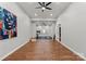 Finished basement featuring wood floors, gym equipment, a mirror, and an art piece at 9433 Wallace Pond Dr, Huntersville, NC 28078