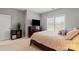Bright bedroom with large window and plush bedding for a relaxing retreat in your new home at 9433 Wallace Pond Dr, Huntersville, NC 28078