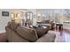 Bright living room with large windows and a comfortable seating area. Hardwood floors and a neutral color palette create a welcoming space at 9433 Wallace Pond Dr, Huntersville, NC 28078