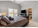 Comfortable main bedroom featuring a luxurious leather bed frame and an adjacent bathroom for added convenience at 9433 Wallace Pond Dr, Huntersville, NC 28078