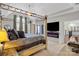 Spacious main bedroom with a four-poster bed, fireplace, television, and windows at 9433 Wallace Pond Dr, Huntersville, NC 28078