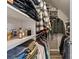 Organized walk-in closet with shelving, hanging rods, and ample storage space for clothes and accessories at 9433 Wallace Pond Dr, Huntersville, NC 28078