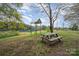 Backyard featuring a gazebo and picnic table offering a peaceful outdoor retreat by the water at 9937 Harwood Ln, Charlotte, NC 28214