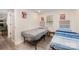 Shared bedroom with two twin beds, built-in wardrobe, and windows providing natural light at 9937 Harwood Ln, Charlotte, NC 28214