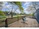 Relaxing deck overlooking backyard, providing a serene outdoor seating area with a hammock chair at 9937 Harwood Ln, Charlotte, NC 28214