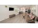 Open-concept living area with stylish furniture, laminate flooring, and a seamless flow to the kitchen at 9937 Harwood Ln, Charlotte, NC 28214