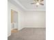 Large carpeted bedroom features a ceiling fan and neutral colors at 10125 Westmoreland Rd, Cornelius, NC 28031