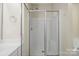 Spacious glass-enclosed shower provides a luxurious bathing experience at 10125 Westmoreland Rd, Cornelius, NC 28031