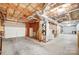 Spacious unfinished basement with garage access, offering potential for various uses at 1022 Kannapolis Pkwy, Concord, NC 28027