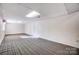 Unfinished basement area with carpet and a single window at 1022 Kannapolis Pkwy, Concord, NC 28027