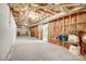 Spacious unfinished basement ready for customization, featuring exposed ceiling and utility access at 1022 Kannapolis Pkwy, Concord, NC 28027