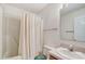 Full bathroom with wallpaper, vanity, and combination shower and tub with white shower curtain at 1022 Kannapolis Pkwy, Concord, NC 28027
