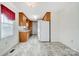 Eat-in kitchen features matching cabinetry, laminate countertop, and tile flooring at 1022 Kannapolis Pkwy, Concord, NC 28027