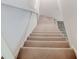 Interior carpeted staircase leading to the second floor of the home at 1022 Kannapolis Pkwy, Concord, NC 28027