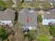 Aerial view of the backyard showing a patio, deck, and lush surroundings providing privacy and outdoor enjoyment at 1033 Ridge Haven Rd, Waxhaw, NC 28173