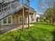 A spacious backyard with a well-maintained lawn, a patio, and a deck, perfect for outdoor entertaining at 1033 Ridge Haven Rd, Waxhaw, NC 28173