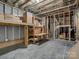 Unfinished basement with exposed ceiling and wood framing, offering potential for future expansion and customization at 1033 Ridge Haven Rd, Waxhaw, NC 28173