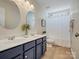 Bathroom featuring a dual sink vanity, framed mirrors, and shower at 1033 Ridge Haven Rd, Waxhaw, NC 28173