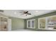 Sunlit bedroom features a ceiling fan, large windows, and neutral carpeting creating a comfortable space at 1033 Ridge Haven Rd, Waxhaw, NC 28173