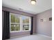Cozy bedroom with carpeting, natural light, and neutral paint at 1033 Ridge Haven Rd, Waxhaw, NC 28173