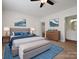 Stylishly furnished bedroom with a comfortable bed, coordinating decor, and an ensuite bathroom at 1033 Ridge Haven Rd, Waxhaw, NC 28173