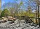 Relaxing deck area with comfortable outdoor seating, perfect for enjoying the surrounding trees and nature at 1033 Ridge Haven Rd, Waxhaw, NC 28173