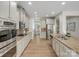 Spacious open concept kitchen with granite counters, stainless appliances, and ample storage at 1033 Ridge Haven Rd, Waxhaw, NC 28173