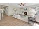 Inviting living room featuring a cozy fireplace, ceiling fan, and comfortable seating arrangements at 1033 Ridge Haven Rd, Waxhaw, NC 28173